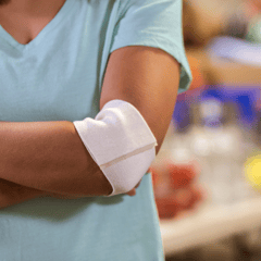 Image of a person with a bandage on their arm after plasma donation